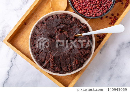 sweet red bean paste in a bowl, homemade azuki bean paste cooking ingredient for asian pastry sweet red bean paste in a bowl, homemade azuki bean paste cooking ingredient for asian pastry 140945069
