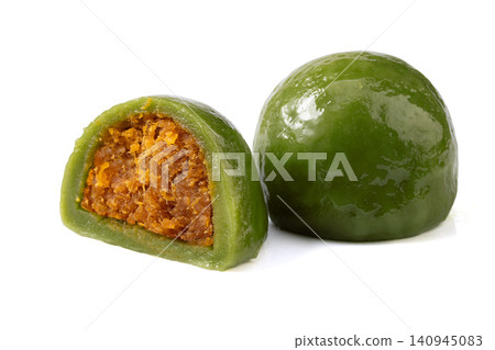 salted egg yolk and meat floss green rice ball, cut Qingtuan mochi showing savory filling on white background salted egg yolk and meat floss green rice ball, cut Qingtuan mochi showing savory filling on white background 140945083
