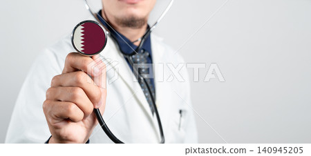 Qatar healthcare system, Qatari national healthcare concept. Hand of doctor holding stethoscope Qatar healthcare system, Qatari national healthcare concept. Hand of doctor holding stethoscope 140945205