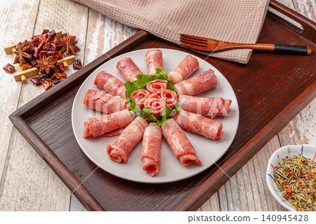 raw bacon rolls on skewers with spices, prepared for grilling Japanese Yakitori or Chinese barbecue. raw bacon rolls on skewers with spices, prepared for grilling Japanese Yakitori or Chinese barbecue. 140945428