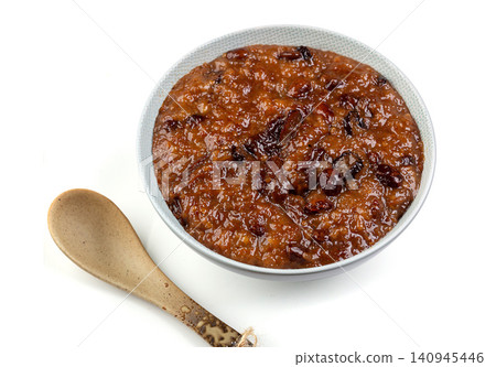 traditional Zenggao, a steamed sweet glutinous rice pudding layered with red dates and kidney beans. traditional Zenggao, a steamed sweet glutinous rice pudding layered with red dates and kidney beans. 140945446