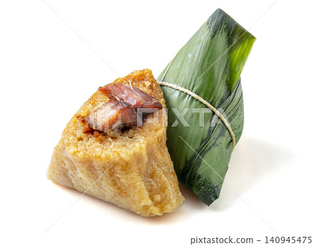 savory glutinous rice zongzi dumpling filled with marinated pork belly and wrapped in bamboo leaves. savory glutinous rice zongzi dumpling filled with marinated pork belly and wrapped in bamboo leaves. 140945475