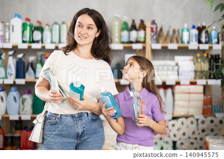 Mom and daughter choose a dental care kit Mom and daughter choose a dental care kit 140945575