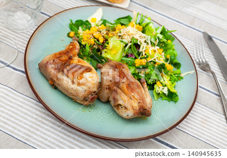 Fried quail garnished with portion of fresh vegetable salad Fried quail garnished with portion of fresh vegetable salad 140945635