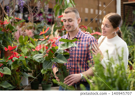 Couple man and woman choosing anthurium in flower shop 140945707