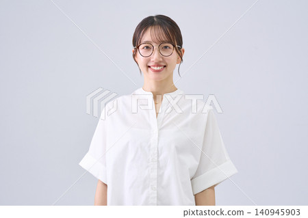 A smiling Japanese woman wearing glasses A smiling Japanese woman wearing glasses 140945903