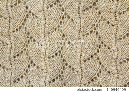 Background texture of beige pattern knitted fabric made of cotton or wool closeup Background texture of beige pattern knitted fabric made of cotton or wool closeup 140946409