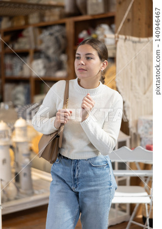 Girl inspect furniture store, searching for perfect item to buying. Girl inspect furniture store, searching for perfect item to buying. 140946467