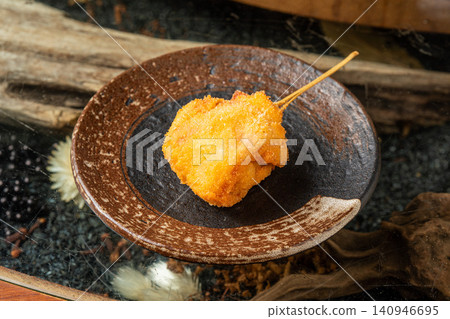 Mushroom wrapped in bacon and deep-fried on a skewer Mushroom wrapped in bacon and deep-fried on a skewer 140946695