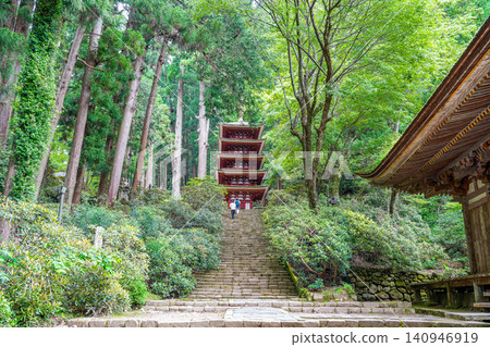 Tourists climbing the stone steps to the five-story pagoda of Murō-ji Temple in Uda City, Nara Prefecture, surrounded by fresh greenery. Tourists climbing the stone steps to the five-story pagoda of Murō-ji Temple in Uda City, Nara Prefecture, surrounded by fresh greenery. 140946919