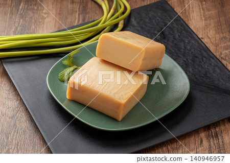 traditional Chinese Rice Tofu Blocks Rice Jelly Cake with Garlic Scapes traditional Chinese Rice Tofu Blocks Rice Jelly Cake with Garlic Scapes 140946957