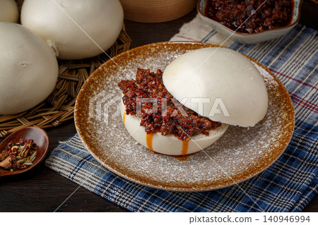 steamed Bun Sandwich with Beef and Spicy Chili Sauce, Chinese Traditional Food steamed Bun Sandwich with Beef and Spicy Chili Sauce, Chinese Traditional Food 140946994