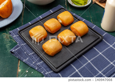 traditional Chinese Fried Steamed Buns Sweet Milk Flavor Mantou Dim Sum on Plate traditional Chinese Fried Steamed Buns Sweet Milk Flavor Mantou Dim Sum on Plate 140947008