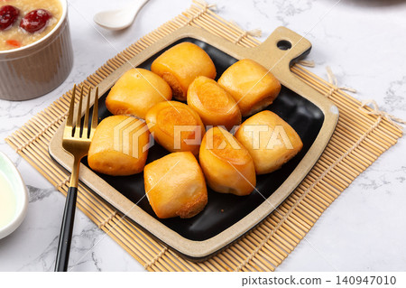 traditional Chinese Fried Steamed Buns Sweet Milk Flavor Mantou Dim Sum on Plate traditional Chinese Fried Steamed Buns Sweet Milk Flavor Mantou Dim Sum on Plate 140947010