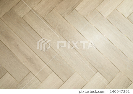 Light wood flooring covers surface, enhancing interior space Light wood flooring covers surface, enhancing interior space 140947291