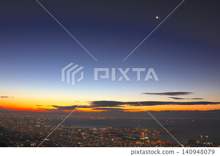 A night view of Osaka Bay bathed in the morning glow of the sunrise on New Year's Day, as seen from Kikuseidai Observatory on Mount Rokko. A night view of Osaka Bay bathed in the morning glow of the sunrise on New Year's Day, as seen from Kikuseidai Observatory on Mount Rokko. 140948079