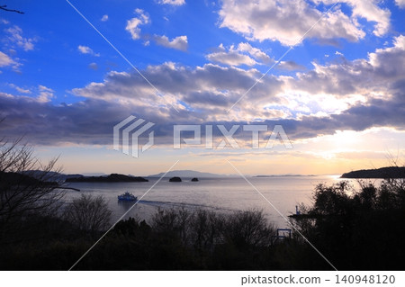View of the sunset over the Seto Inland Sea islands from "Kuroshima Venus Road" / from Ushimado Tenjin Shrine View of the sunset over the Seto Inland Sea islands from "Kuroshima Venus Road" / from Ushimado Tenjin Shrine 140948120
