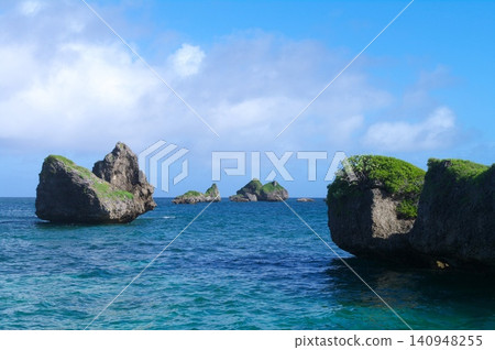 The breathtaking coastal scenery of Ogami Island – crystal-clear emerald green sea and unique rock formations. The breathtaking coastal scenery of Ogami Island – crystal-clear emerald green sea and unique rock formations. 140948255