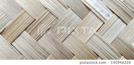 Natural woven bamboo texture with a traditional handmade pattern. Natural woven bamboo texture with a traditional handmade pattern. 140948289