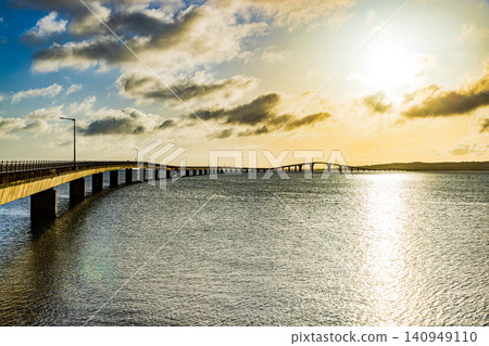 Miyako Island: Irabu Bridge illuminated by the setting sun Miyako Island: Irabu Bridge illuminated by the setting sun 140949110