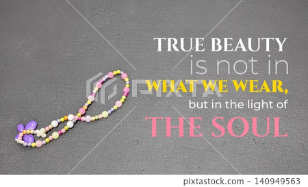 An inspirational quote about inner beauty sits on a dark gray textured background. The image includes a colorful beaded bracelet shaped like an infinity symbol. The text emphasizes that true beauty 140949563