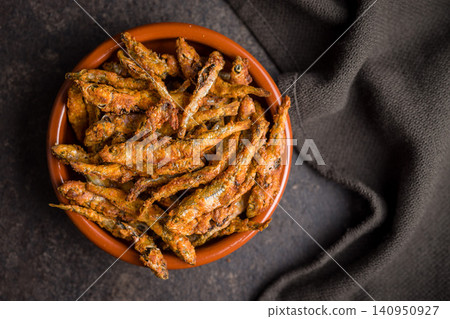 Crispy Fried smelts in Bowl . Golden Small Fish Snack and Seafood Appetizer Crispy Fried smelts in Bowl . Golden Small Fish Snack and Seafood Appetizer 140950927