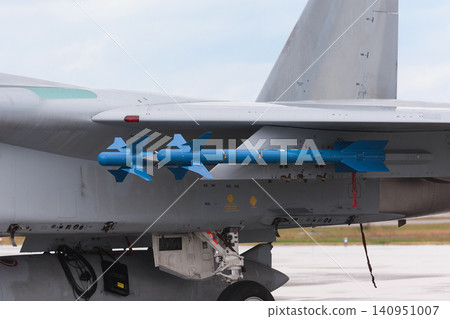 Japan Air Self-Defense Force F-15J Eagle and Type 90 air-to-air guided missile after the rain. 140951007