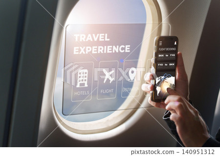 Person using transparent screen for futuristic in-flight travel experience Person using transparent screen for futuristic in-flight travel experience 140951312