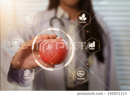 Nutritionist holding red apple with digital interface for healthy eating concept Nutritionist holding red apple with digital interface for healthy eating concept 140951313