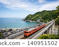 A train running along the coast as seen from Amarube Station. A train running along the coast as seen from Amarube Station. 140951502