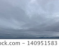 A calm horizon shrouded in soft clouds 140951583
