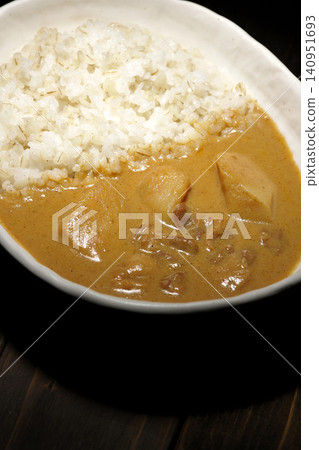 Barley rice and Massaman curry photographed separately. Barley rice and Massaman curry photographed separately. 140951693