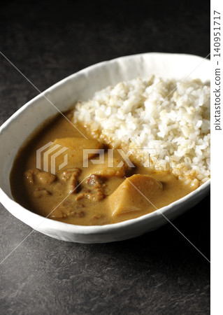 Barley rice and Massaman curry photographed separately. Barley rice and Massaman curry photographed separately. 140951717