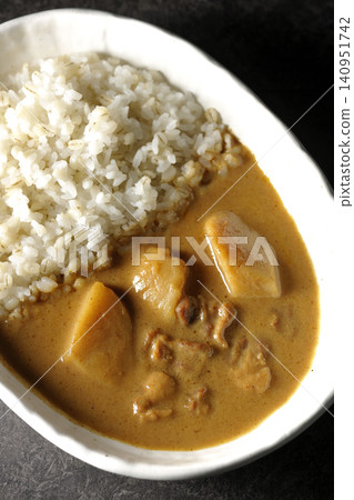 Barley rice and Massaman curry photographed separately. Barley rice and Massaman curry photographed separately. 140951742