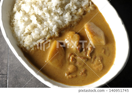 Barley rice and Massaman curry photographed separately. Barley rice and Massaman curry photographed separately. 140951745