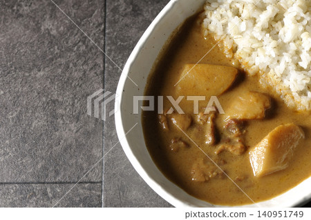 Barley rice and Massaman curry photographed separately. 140951749