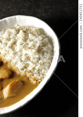 Barley rice and Massaman curry photographed separately. Barley rice and Massaman curry photographed separately. 140951751