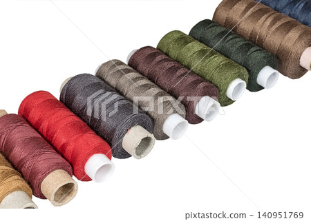 Multicolored sewing threads bobbins 140951769