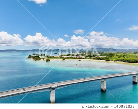 A scenic drive across Kouri Bridge in Nakijin Village, Okinawa (emerald green sea and blue sky) A scenic drive across Kouri Bridge in Nakijin Village, Okinawa (emerald green sea and blue sky) 140951822