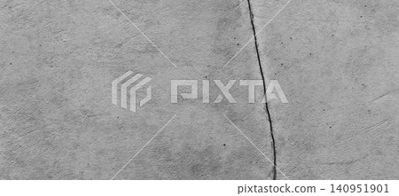 Light gray concrete wall texture with fine vertical cracks. 140951901