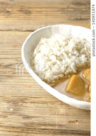 Barley rice and Massaman curry photographed separately. Barley rice and Massaman curry photographed separately. 140951974