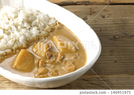 Barley rice and Massaman curry photographed separately. Barley rice and Massaman curry photographed separately. 140951975