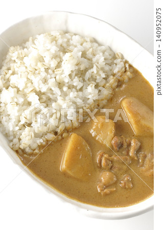 Barley rice and Massaman curry photographed individually against a white background. Barley rice and Massaman curry photographed individually against a white background. 140952075