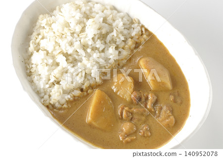 Barley rice and Massaman curry photographed individually against a white background. Barley rice and Massaman curry photographed individually against a white background. 140952078