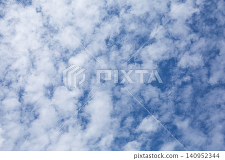 Blue sky with scattered white clouds 140952344