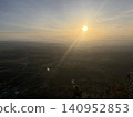 A mystical sunrise spreading across the land. 140952853