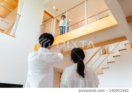 A custom-built house with a connecting corridor in the atrium. A custom-built house with a connecting corridor in the atrium. 140952982