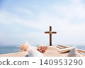 A cross and a conch shell on the seaside beach, a summer retreat and summer Bible school, and a cool summer camp background. 140953290