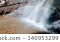 A beautiful rainbow sparkling in the waterfall spray. 140953299