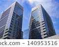 Clouds reflected in the windows of an office building 140953516